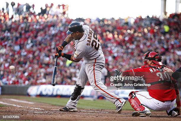 Hector Sanchez of the San Francisco Giants bats during Game 4 of the National League Division Series against the Cincinnati Reds on Wednesday,...