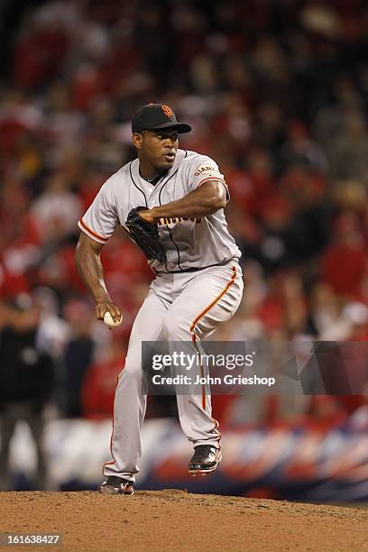 Santiago Casilla of the San Francisco Giants pitches during Game 4 of the National League Division Series against the Cincinnati Reds on Wednesday,...