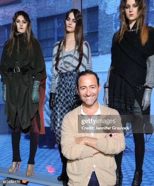 Fashion designer Diego Binetti and Models pose during the Diego Binetti Fall 2013 Mercedes-Benz Fashion Presentation held at Westbeth Gallery on...