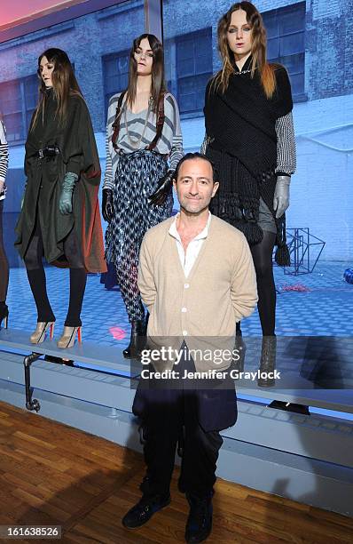 Fashion designer Diego Binetti and Models pose during the Diego Binetti Fall 2013 Mercedes-Benz Fashion Presentation held at Westbeth Gallery on...