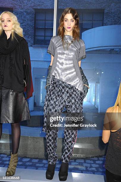 Models pose during the Diego Binetti Fall 2013 Mercedes-Benz Fashion Presentation held at Westbeth Gallery on February 13, 2013 in New York City.