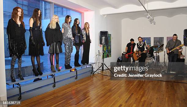 Models pose during the Diego Binetti Fall 2013 Mercedes-Benz Fashion Presentation held at Westbeth Gallery on February 13, 2013 in New York City.