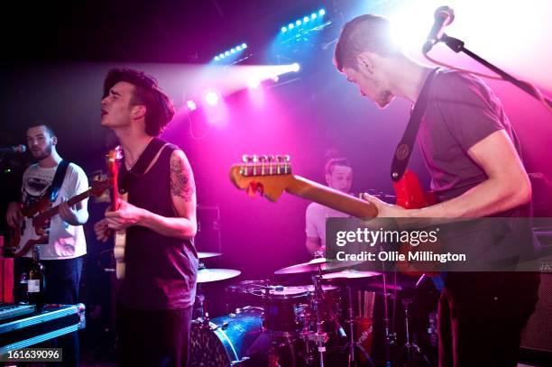 Ross MacDonald, Matthew Healy, George Daniel and Adam Hann of The 1975 perform on stage at The Bodega Social Club on February 13, 2013 in Nottingham,...