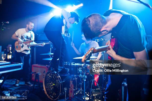 Ross MacDonald, Matthew Healy, George Daniel and Adam Hann of The 1975 perform on stage at The Bodega Social Club on February 13, 2013 in Nottingham,...