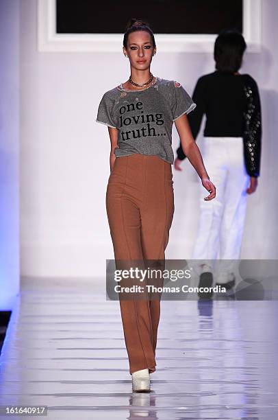 Model walks the runway at Junk Food Art House and Sony Pictures presents "Le Look Smurfette" at STYLE360 presented by Conair Fashion Pavilion on...