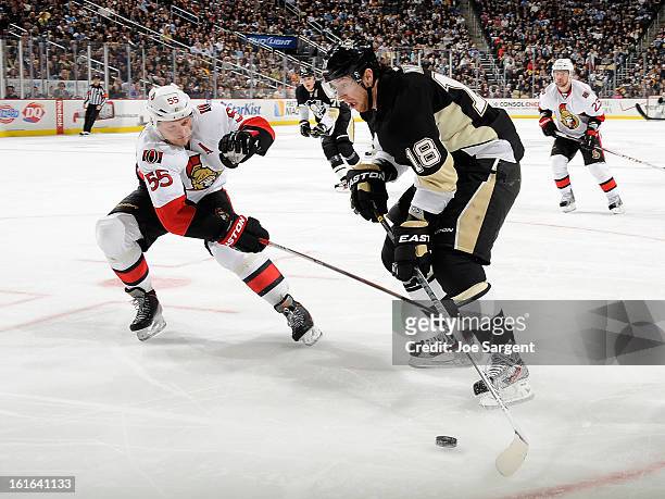 Sergei Gonchar of the Ottawa Senators battles for the puck against James Neal of the Pittsburgh Penguins on February 13, 2013 at Consol Energy Center...