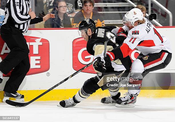 Pascal Dupuis of the Pittsburgh Penguins skates past the defense of Daniel Alfredsson of the Ottawa Senators on February 13, 2013 at Consol Energy...