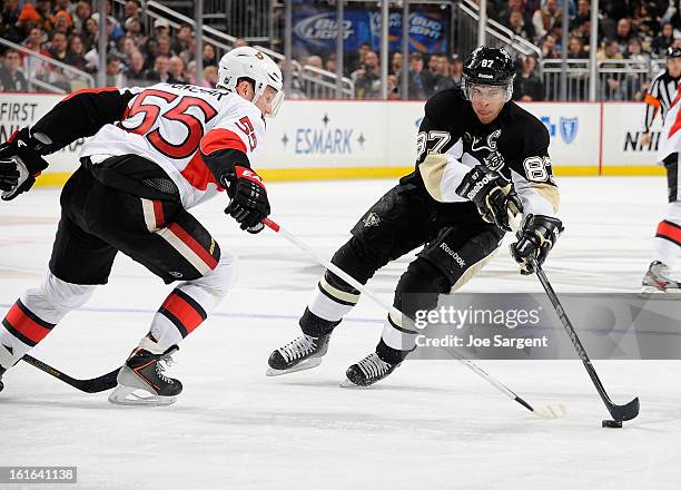 Sidney Crosby of the Pittsburgh Penguins gets past the defense of Sergei Gonchar of the Ottawa Senators on February 13, 2013 at Consol Energy Center...