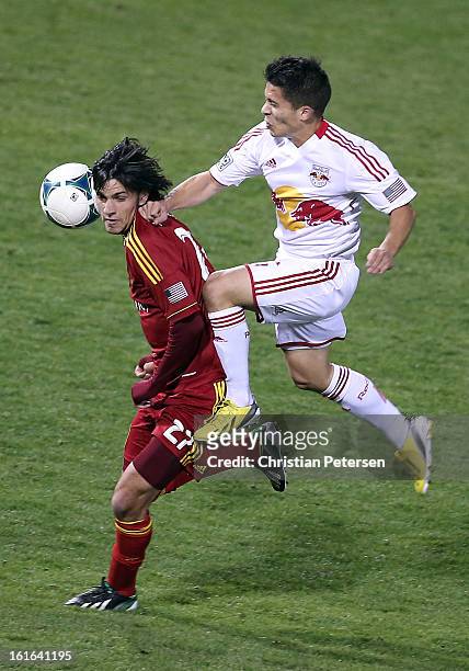 John Stertzer of Real Salt Lake attempts to control the ball pressured by Connor Lade of the New York Red Bulls during the first half of the FC...