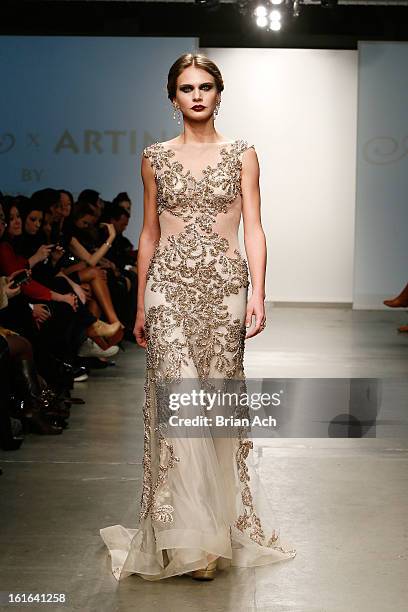 Model walks the runway at the Dany Tabet show during Nolcha Fashion Week New York 2013 presented by RUSK at Pier 59 Studios on February 13, 2013 in...