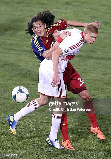 Devon Sandoval of Real Salt Lake attempts to control the ball pressured by Markus Holgersson of the New York Red Bulls during the first half of the...