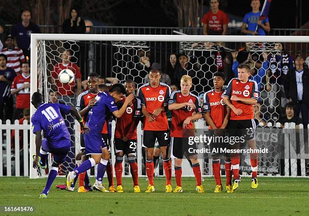 Midfielder Adam Mbenque of Orlando City attempts a penalty kick against Toronto FC February 13, 2013 in the second round of the Disney Pro Soccer...