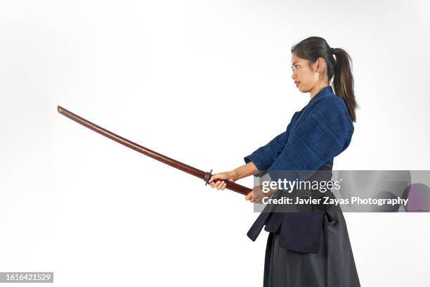 japanese young woman kendo fighter - holding sword stock pictures, royalty-free photos & images