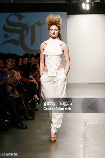 Model walks the runway at the Samantha Cole London show during Nolcha Fashion Week New York 2013 presented by RUSK at Pier 59 Studios on February 13,...