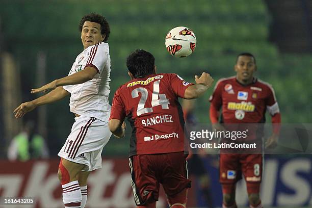Wellington Nem Fluminense fights for the ball with FC Caracas Andres Sanchez during a match between Caracas FC and Fluminense as part of the 2013...