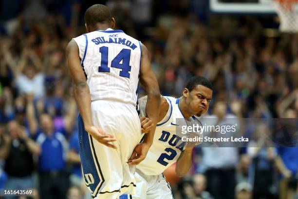 Teammates Quinn Cook and Rasheed Sulaimon of the Duke Blue Devils celebrate after a play during their game against the North Carolina Tar Heels at...