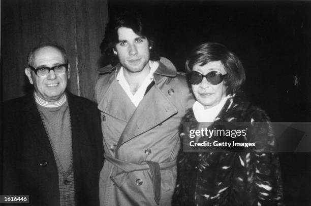 American actor John Travolta poses with his father, Salvatore Travolta, and his mother, Helen Travolta, c. 1976.