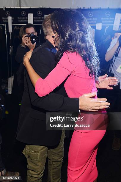 Designer Michael Kors and actress Zoe Saldana pose backstage at the Michael Kors Fall 2013 fashion show during Mercedes-Benz Fashion Week at The...