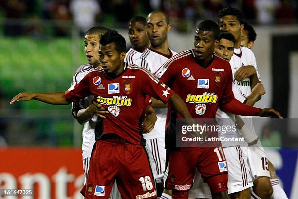 James Cabezas and Luis Gonzalez of Caracas FC during a match between Caracas FC and Fluminense as part of the 2013 Copa Bridgestone Libertadores at...