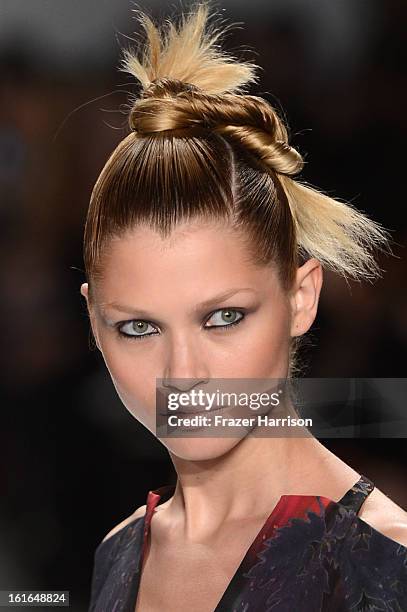 Model walks the runway at the Nanette Lepore Fall 2013 fashion show during Mercedes-Benz Fashion Week at The Stage at Lincoln Center on February 13,...