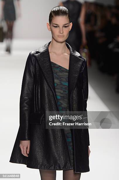 Model walks the runway at the Nanette Lepore Fall 2013 fashion show during Mercedes-Benz Fashion Week at The Stage at Lincoln Center on February 13,...