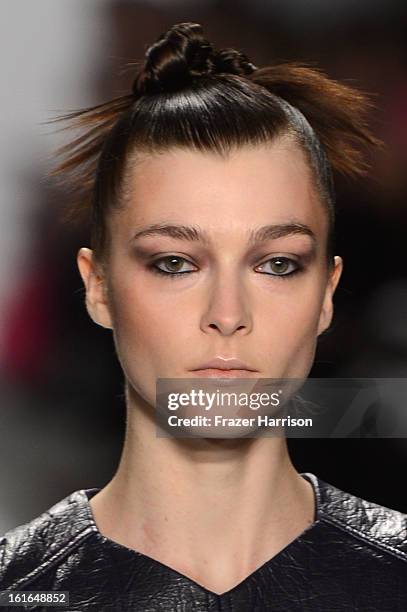 Model walks the runway at the Nanette Lepore Fall 2013 fashion show during Mercedes-Benz Fashion Week at The Stage at Lincoln Center on February 13,...