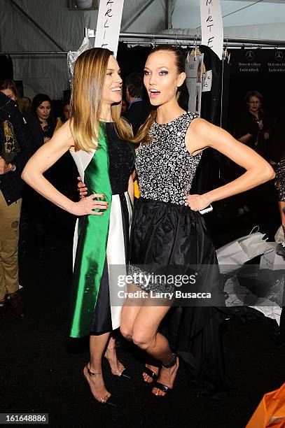 Hilary Swank and model Karlie Kloss pose backstage at the Michael Kors Fall 2013 fashion show during Mercedes-Benz Fashion Week at The Theatre at...