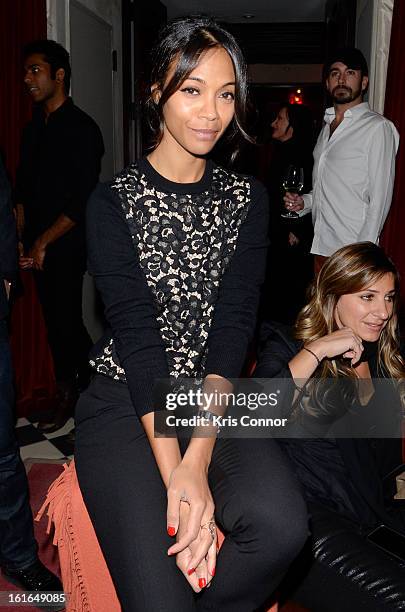 Zoe Saldana poses for a photo during the Gents Launch Party during Fall 2013 Mercedes-Benz Fashion Week at Gramercy Park Hotel on February 13, 2013...