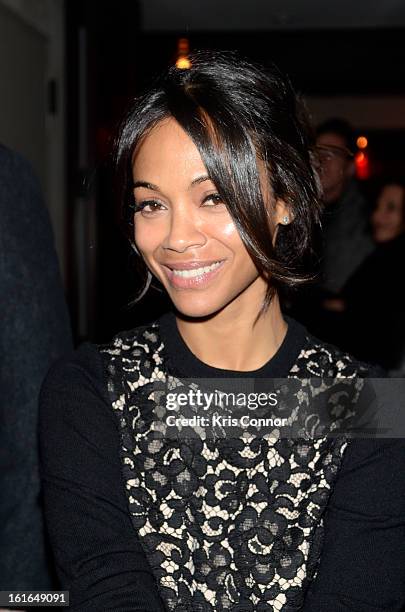 Zoe Saldana poses for a photo during the Gents Launch Party during Fall 2013 Mercedes-Benz Fashion Week at Gramercy Park Hotel on February 13, 2013...