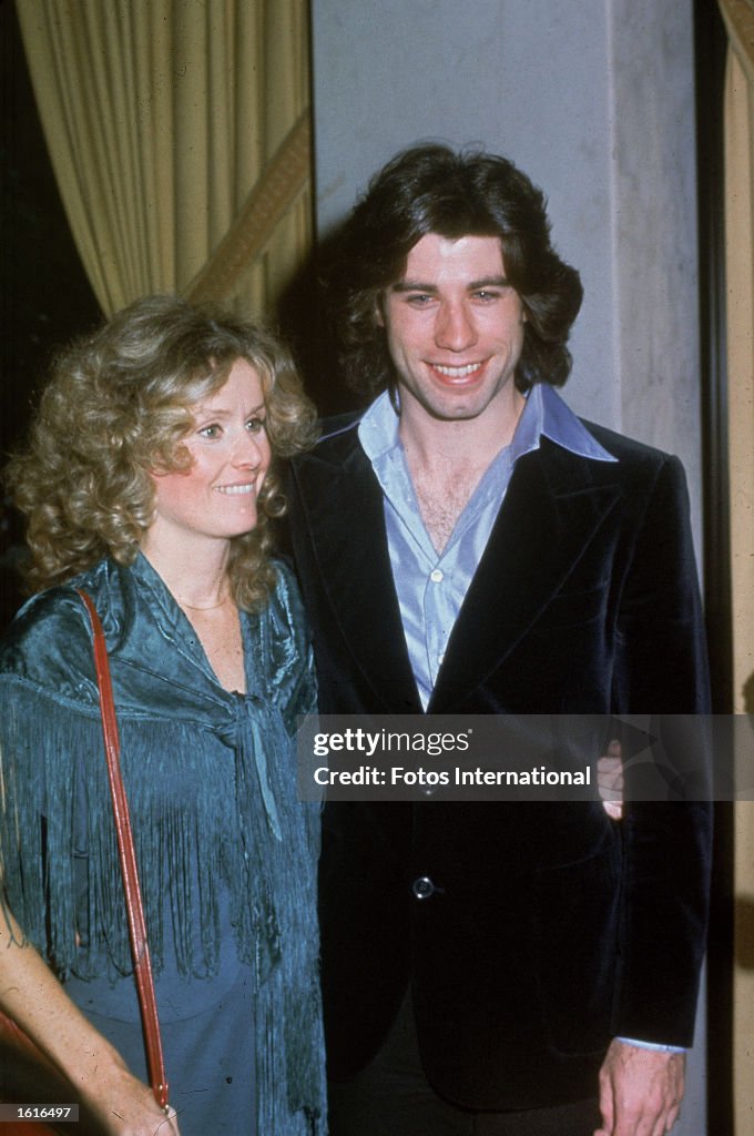 John Travolta Accepting Emmy For Diana Hyland American actor John Travolta poses with his girlfriend Dianna Hyland