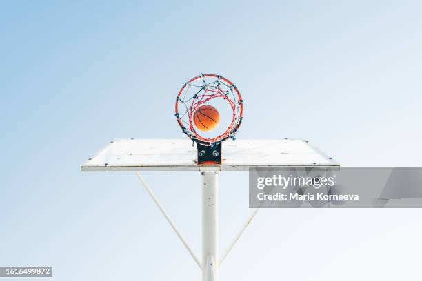 basketball in a basketball basket, bottom view. - jump shot ストックフォトと画像