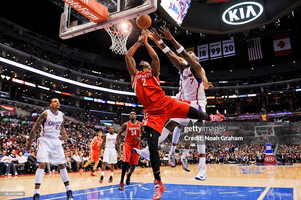 Houston Rockets Marcus Marcus Morris of the Houston Rockets shoots a layup against Lamar ...