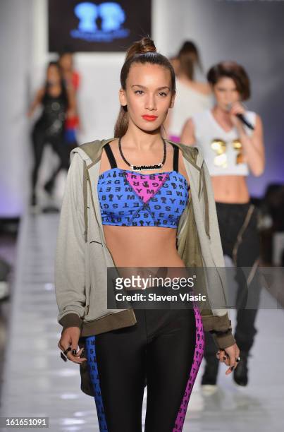 Model walks the runway at the Boy Meets Girl by Stacy Igel fall 2013 fashion show during Conair Style360 at Metropolitan Pavilion on February 13,...