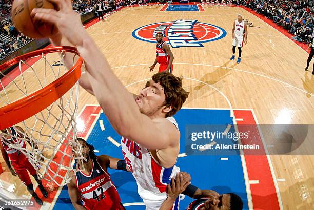 Viacheslav Kravtsov of the Detroit Pistons dunks against the Washington Wizards on February 13, 2013 at The Palace of Auburn Hills in Auburn Hills,...