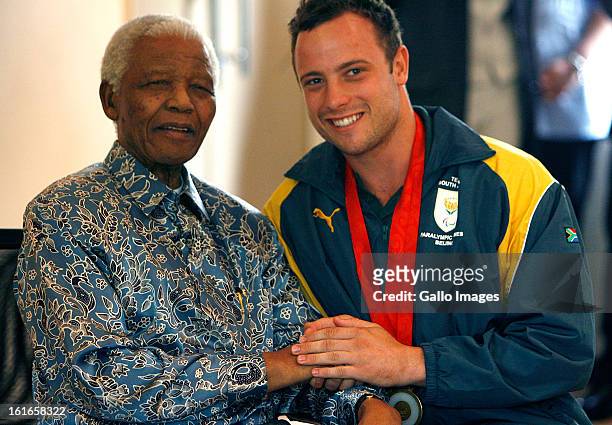 Former South African President, Nelson Mandela and Oscar Pistorius on October 3 in South Africa.