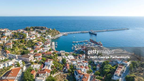 aerial view of evdilos town on ikaria island, greece - ikaria island stock pictures, royalty-free photos & images