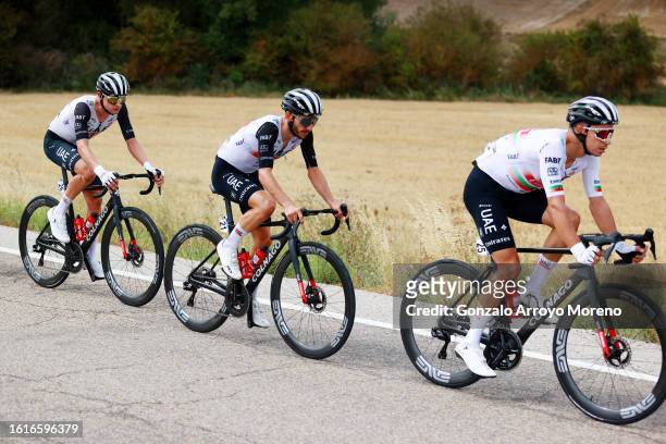 Jay Vine of Australia, Adam Yates of Great Britain and Ivo Manuel Alves Oliveira of Portugal and UAE Team Emirates compete during the 45th Vuelta a...