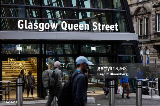 Shoppers and pedestrians pass Glasgow Queen Street railway station in the center of Glasgow, UK, on Friday, Aug. 18, 2023. It's been almost a decade...