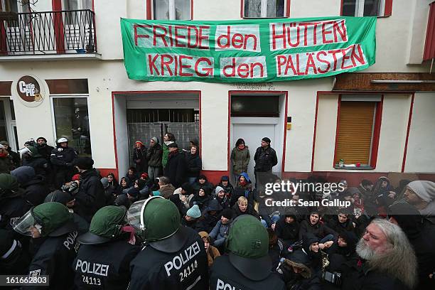 Riot police watch over protesters blockading the entrance to Lausitzer Strasse 8 to prevent the eviction of the German-Turkish Gulbol family on...