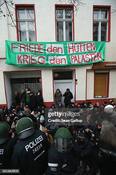 Riot police watch over protesters blockading the entrance to Lausitzer Strasse 8 to prevent the eviction of the German-Turkish Gulbol family on...