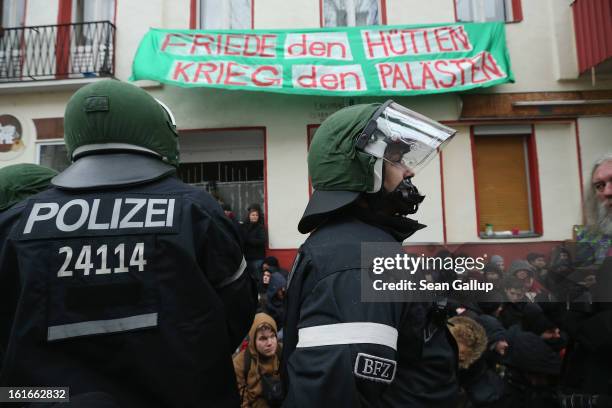 Riot police watch over protesters blockading the entrance to Lausitzer Strasse 8 to prevent the eviction of the German-Turkish Gulbol family on...