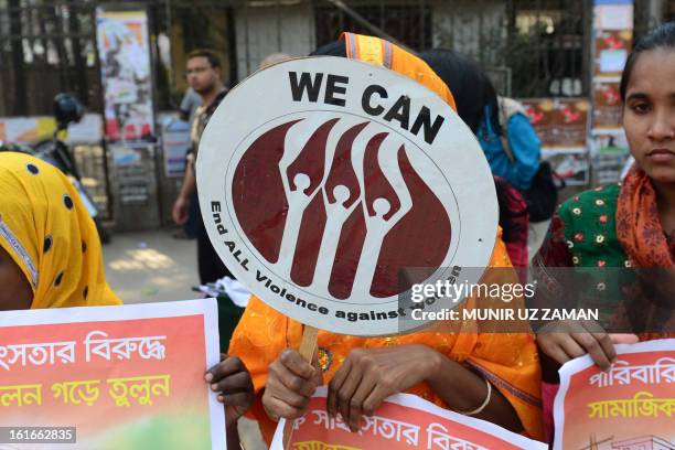 Bangladeshi women form a human chain as they participate in a One Billion Rising rally in Dhaka on February 14, 2013. The one-day event called for...