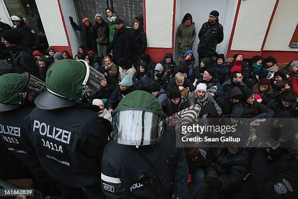 Riot police watch over protesters blockading the entrance to Lausitzer Strasse 8 to prevent the eviction of the German-Turkish Gulbol family on...