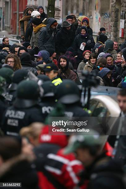 Protesters demonstrate near the entrance to Lausitzer Strasse 8 to prevent the eviction of the German-Turkish Gulbol family as riot police look on on...