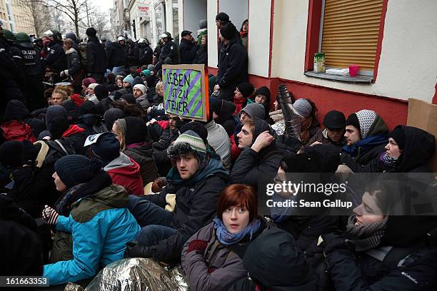 Riot police watch over protesters blockading the entrance to Lausitzer Strasse 8 to prevent the eviction of the German-Turkish Gulbol family on...