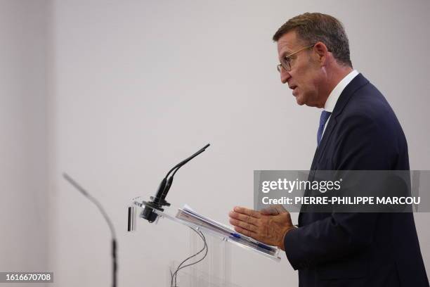 The candidate of conservative Partido Popular Alberto Nunez Feijoo gestures during a press conference after meeting with the King as part of the...