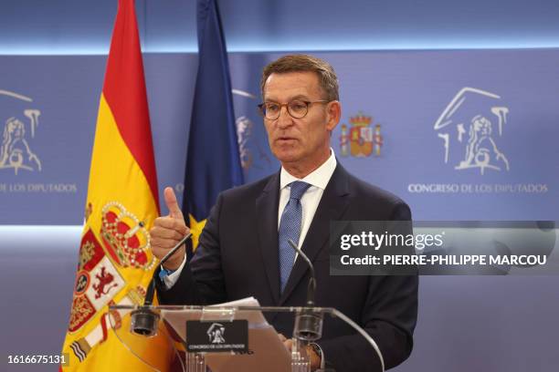 The candidate of conservative Partido Popular Alberto Nunez Feijoo gestures during a press conference after meeting with the King as part of the...