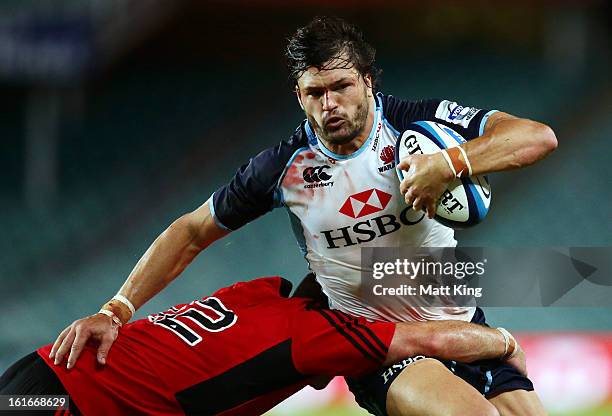 Adam Ashley-Cooper of the Waratahs takes on the defence during the Super Rugby trial match between the Waratahs and the Crusaders at Allianz Stadium...