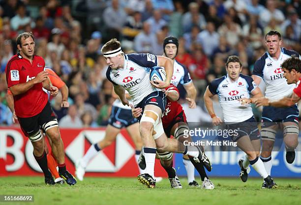Jed Holloway of the Waratahs takes on the defence during the Super Rugby trial match between the Waratahs and the Crusaders at Allianz Stadium on...