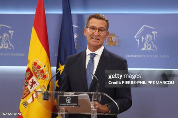 The candidate of conservative Partido Popular Alberto Nunez Feijoo speaks during a press conference after meeting with the King as part of the round...